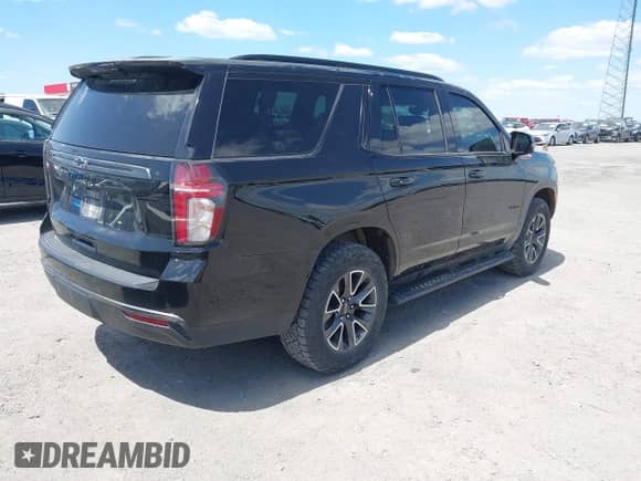 2022 Chevrolet Tahoe Z71 z VIN 1GNSKPKD2NR174478, wystawiony jako IAAI lot #42016813 z przebiegiem 71 801 mil mil oraz . Historia ofert i sprzedaży dostępna na DreamBid. Obrazek 4.