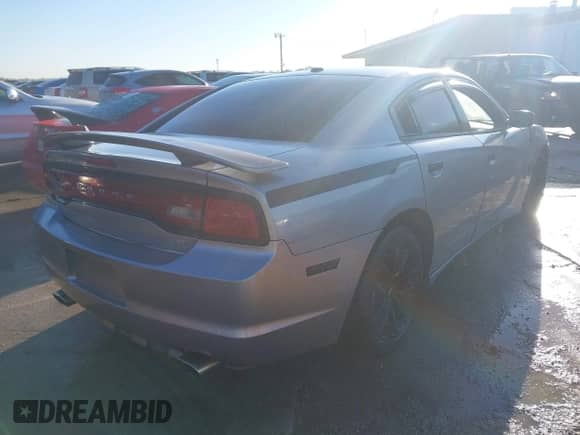 2014 Dodge Charger SXT with VIN 2C3CDXHG2EH239214, listed as a IAAI auction lot 43595966 with 219,931 mi miles and . Bid and sale history available at DreamBid. Image 4.