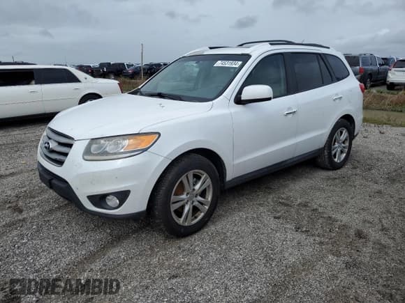 ✅ 2012 Hyundai Santa Fe Limited • VIN: 5XYZKDAG1CG143185 • Lot: 74531934. Listed on Copart with 186,312 mi. Free auction sales archive from the USA and detailed vehicle history report at DreamBid. Image 1.