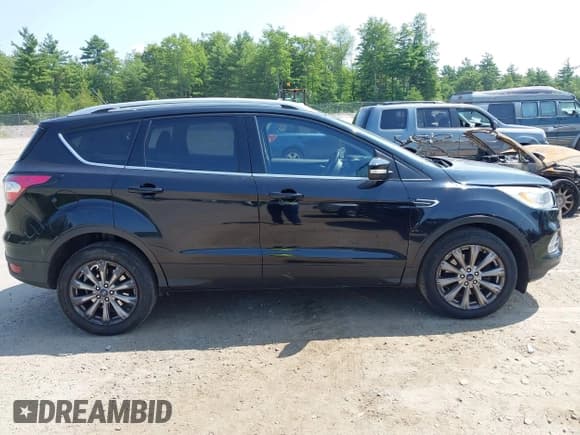 ✅ 2018 Ford Escape Titanium • VIN: 1FMCU9J9XJUA58366 • Lot: 42941884. Listed on IAAI with 157,052 mi. Free auction sales archive from the USA and detailed vehicle history report at DreamBid. Image 13.