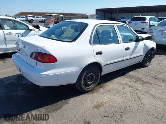 ✅ 1999 Toyota Corolla VE • VIN: 1NXBR12E5XZ199901 • Lot: 42769569. Listed on IAAI with 82,611 mi. Free auction sales archive from the USA and detailed vehicle history report at DreamBid. Image 4.