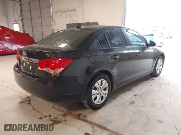 ✅ 2015 Chevrolet Cruze LS • VIN: 1G1PA5SHXF7205443 • Lot: 43491008. Listed on IAAI with 129,936 mi. Free auction sales archive from the USA and detailed vehicle history report at DreamBid. Image 4.