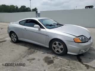 2004 Hyundai Tiburon GS с VIN KMHHM65D44U105236, выставлен на аукционе Copart как лот 67358735 с пробегом 166 537 миль миль и Списание • Salvage title. История ставок и продаж доступна на DreamBid. Изображение 4.