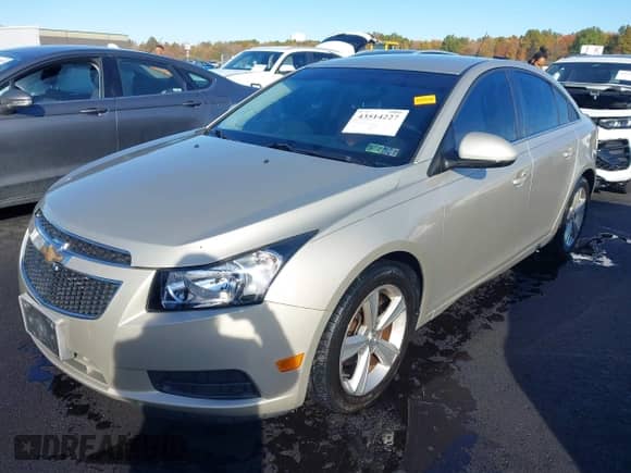 2014 Chevrolet Cruze 2LT with VIN 1G1PE5SBXE7257699, listed as a IAAI auction lot 43514227 with 131,115 mi miles and . Bid and sale history available at DreamBid. Image 2.