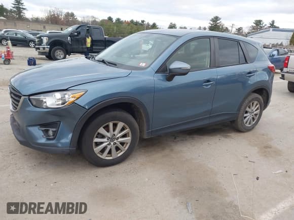 ✅ 2016 Mazda CX-5 Touring • VIN: JM3KE4CY4G0890927 • Lot: 43591262. Wystawiony na IAAI z przebiegiem 153 413 mil. Bezpłatny archiwum sprzedaży aukcyjnych z USA i szczegółowy raport historii pojazdu na DreamBid. Zdjęcie 2.