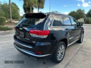 ✅ 2018 Jeep Grand Cherokee Summit • VIN: 1C4RJFJG4JC218011 • Lot: 91515965. Listed on Copart with 140,761 mi. Free auction sales archive from the USA and detailed vehicle history report at DreamBid. Image 4.