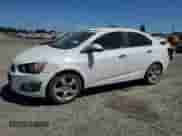 2014 Chevrolet Sonic LTZ с VIN 1G1JE5SG0E4123626, выставлен на аукционе Copart как лот 61103254 с пробегом 158 390 миль миль и Списание • Salvage title. История ставок и продаж доступна на DreamBid. Изображение 1.