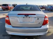 ✅ 2010 Ford Fusion Hybrid • VIN: 3FADP0L31AR277041 • Lot: 90712635. Wystawiony na Copart z przebiegiem 127 672 mil. Bezpłatny archiwum sprzedaży aukcyjnych z USA i szczegółowy raport historii pojazdu na DreamBid. Zdjęcie 6.