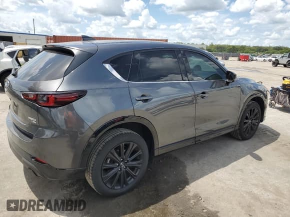 ✅ 2022 Mazda CX-5 2.5 Turbo • VIN: JM3KFBAY6N0607767 • Лот: 71276325. Опубликован ранее на Copart с пробегом 63 133 миль. Бесплатный доступ к архиву аукционных продаж из США и подробный отчёт об истории автомобиля на DreamBid. Изображение 3.