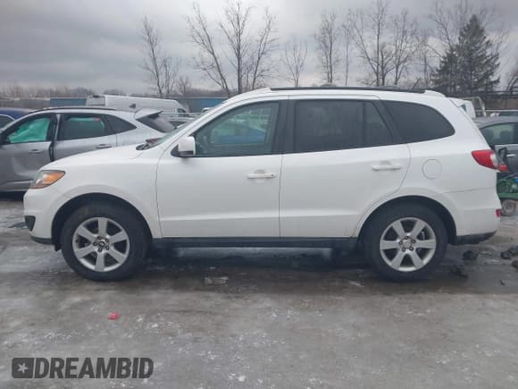 ✅ 2011 Hyundai Santa Fe Limited • VIN: 5XYZHDAGXBG008896 • Lot: 41564444. Listed on IAAI with 122,104 mi. Free auction sales archive from the USA and detailed vehicle history report at DreamBid. Image 14.
