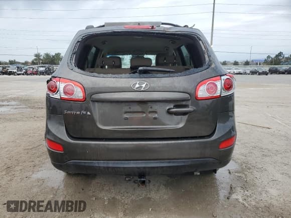 ✅ 2012 Hyundai Santa Fe GLS • VIN: 5XYZG4AG0CG153062 • Lot: 76452394. Listed on Copart with 99,354 mi. Free auction sales archive from the USA and detailed vehicle history report at DreamBid. Image 6.