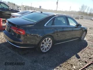 ✅ 2015 Audi A8 4.0T • VIN: WAU32AFDXFN034835 • Лот: 40891264. Опубликован ранее на Copart с пробегом 106 143 миль. Бесплатный доступ к архиву аукционных продаж из США и подробный отчёт об истории автомобиля на DreamBid. Изображение 3.