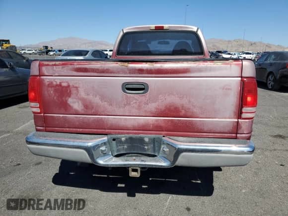 1999 Dodge Dakota SLT z VIN 1B7GG22X5XS215601, wystawiony jako Copart lot #80686715 z przebiegiem 273 332 mil mil oraz Czysty tytuł • Clean title. Historia ofert i sprzedaży dostępna na DreamBid. Obrazek 6.