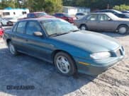 ✅ 1996 Pontiac Grand Am SE • VIN: 1G2NE52M7TC721718 • Lot: 43268073. Wystawiony na IAAI z przebiegiem 115 223 mil. Bezpłatny archiwum sprzedaży aukcyjnych z USA i szczegółowy raport historii pojazdu na DreamBid. Zdjęcie 1.