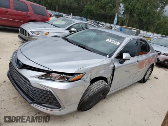 2021 Toyota Camry Hybrid LE with VIN 4T1C31AK7MU562031, listed as a Copart auction lot 71506375 with 82,877 mi miles and Salvage title. Bid and sale history available at DreamBid. Image 1.