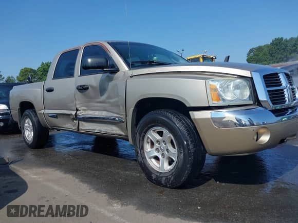 2005 Dodge Dakota Laramie with VIN 1D7HE58N65S128701, listed as a IAAI auction lot 42612813 with 133,800 mi miles and . Bid and sale history available at DreamBid. Image 13.