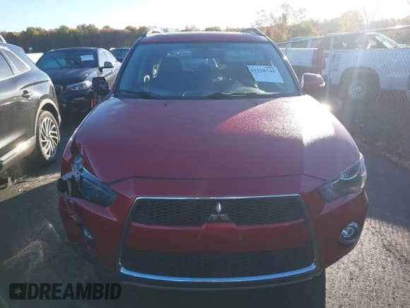2012 Mitsubishi Outlander SE z VIN JA4JT3AW5CU002950, wystawiony jako IAAI lot #43528744 z przebiegiem 111 659 mil mil oraz . Historia ofert i sprzedaży dostępna na DreamBid. Obrazek 13.