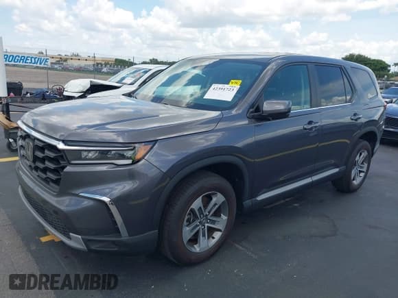 ✅ 2023 Honda Pilot EX-L • VIN: 5FNYG1H45PB035253 • Lot: 42391723. Listed on IAAI with 5,879 mi. Free auction sales archive from the USA and detailed vehicle history report at DreamBid. Image 2.