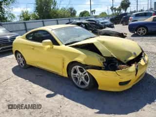 2006 Hyundai Tiburon GT z VIN KMHHN65F96U203308, wystawiony jako Copart lot #47278684 z przebiegiem 186 123 mil mil oraz Szkoda całkowita • Salvage title. Historia ofert i sprzedaży dostępna na DreamBid. Obrazek 4.