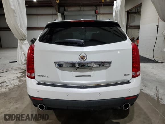 ✅ 2013 Cadillac SRX Premium Collection • VIN: 3GYFNJE32DS571017 • Лот: 90260825. Опубликован ранее на Copart с пробегом 135 219 миль. Бесплатный доступ к архиву аукционных продаж из США и подробный отчёт об истории автомобиля на DreamBid. Изображение 6.