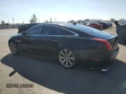 ✅ 2015 Jaguar XJ • VIN: SAJWA1CZ7F8V86845 • Лот: 90777925. Опубликован ранее на Copart с пробегом 61 195 миль. Бесплатный доступ к архиву аукционных продаж из США и подробный отчёт об истории автомобиля на DreamBid. Изображение 2.