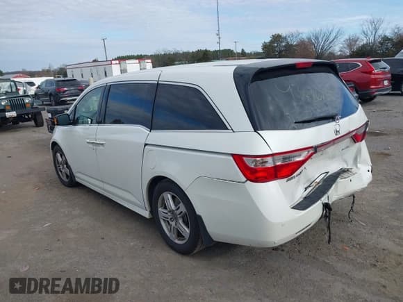✅ 2012 Honda Odyssey Touring • VIN: 5FNRL5H9XCB126080 • Lot: 43686755. Listed on IAAI with 116,383 mi. Free auction sales archive from the USA and detailed vehicle history report at DreamBid. Image 3.