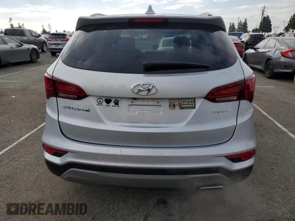 ✅ 2018 Hyundai Santa Fe 2.4L • VIN: 5XYZU3LB7JG517849 • Lot: 93773105. Listed on Copart with 16,936 mi. Free auction sales archive from the USA and detailed vehicle history report at DreamBid. Image 6.
