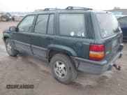 ✅ 1994 Jeep Grand Cherokee Laredo • VIN: 1J4GZ58S0RC216914 • Lot: 43577799. Listed on IAAI with 334,197 mi. Free auction sales archive from the USA and detailed vehicle history report at DreamBid. Image 3.