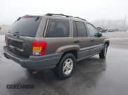 ✅ 1999 Jeep Grand Cherokee Laredo • VIN: 1J4G258S2XC768349 • Lot: 41305102. Listed on IAAI with 136,848 mi. Free auction sales archive from the USA and detailed vehicle history report at DreamBid. Image 4.