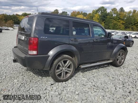 2011 Dodge Nitro Shock z VIN 1D4PU7GX1BW587469, wystawiony jako Copart lot #75915524 z przebiegiem 157 814 mil mil oraz Szkoda całkowita • Salvage title. Historia ofert i sprzedaży dostępna na DreamBid. Obrazek 3.