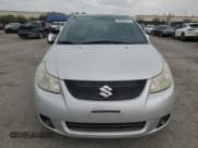 ✅ 2013 Suzuki SX4 LE • VIN: JS2YC5A35D6101897 • Лот: 62202315. Опубликован ранее на Copart с пробегом 120 532 миль. Бесплатный доступ к архиву аукционных продаж из США и подробный отчёт об истории автомобиля на DreamBid. Изображение 5.