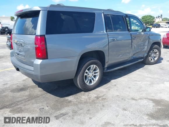 ✅ 2020 Chevrolet Suburban LT • VIN: 1GNSCHKC4LR302047 • Lot: 42518927. Listed on IAAI with 105,760 mi. Free auction sales archive from the USA and detailed vehicle history report at DreamBid. Image 4.