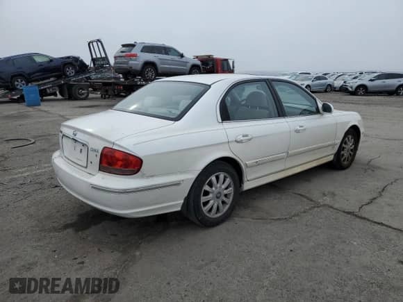2003 Hyundai Sonata GLS с VIN KMHWF35HX3A903193, выставлен на аукционе Copart как лот 88100565 с пробегом 106 309 миль миль и Списание • Salvage title. История ставок и продаж доступна на DreamBid. Изображение 3.
