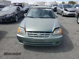 2003 Hyundai Accent GL with VIN KMHCG35C13U277732, listed as a Copart auction lot 72276634 with 135,176 mi miles and Salvage title. Bid and sale history available at DreamBid. Image 5.