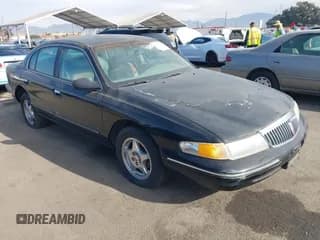 ✅ 1997 Lincoln Continental • VIN: 1LNLM97V5VY665410 • Lot: 41239128. Wystawiony na IAAI z przebiegiem 66 873 mil. Bezpłatny archiwum sprzedaży aukcyjnych z USA i szczegółowy raport historii pojazdu na DreamBid. Zdjęcie 1.