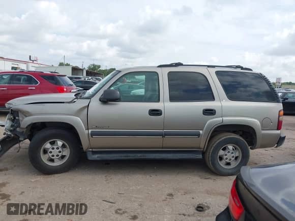 2002 Chevrolet Tahoe LS with VIN 1GNEC13Z42R246617, listed as a IAAI auction lot 42675524 with 306,596 mi miles and . Bid and sale history available at DreamBid. Image 13.