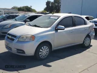2009 Chevrolet Aveo 1LT с VIN KL1TD56E19B377365, выставлен на аукционе Copart как лот 81434555 с пробегом 103 080 миль миль и Списание • Salvage title. История ставок и продаж доступна на DreamBid. Изображение 1.