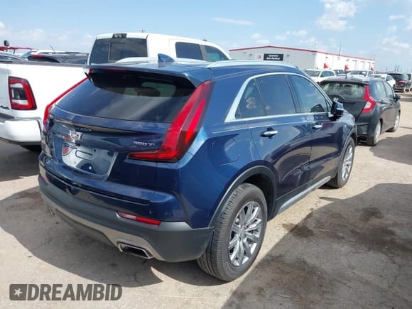 ✅ 2021 Cadillac XT4 FWD Premium Luxury • VIN: 1GYFZCR4XMF042681 • Лот: 42782778. Опубликован ранее на IAAI с пробегом 58 507 миль. Бесплатный доступ к архиву аукционных продаж из США и подробный отчёт об истории автомобиля на DreamBid. Изображение 4.