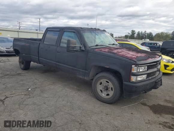 1997 Chevrolet Silverado 3500 with VIN 1GCHC33J3VF052789, listed as a Copart auction lot 86842835 with 137,985 mi miles and Salvage title. Bid and sale history available at DreamBid. Image 4.