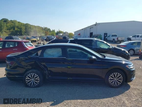 ✅ 2021 Volkswagen Jetta S • VIN: 3VWC57BU1MM024587 • Lot: 43228867. Wystawiony na IAAI z przebiegiem 28 556 mil. Bezpłatny archiwum sprzedaży aukcyjnych z USA i szczegółowy raport historii pojazdu na DreamBid. Zdjęcie 13.