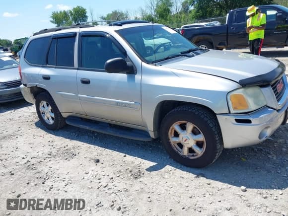 ✅ 2005 GMC Envoy SLE • VIN: 1GKDT13S452325889 • Lot: 42762172. Listed on IAAI with 232,165 mi. Free auction sales archive from the USA and detailed vehicle history report at DreamBid. Image 1.
