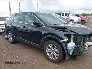 ✅ 2015 Mazda CX-9 Sport • VIN: JM3TB3BV1F0466070 • Lot: 42350686. Wystawiony na IAAI z przebiegiem 110 818 mil. Bezpłatny archiwum sprzedaży aukcyjnych z USA i szczegółowy raport historii pojazdu na DreamBid. Zdjęcie 1.