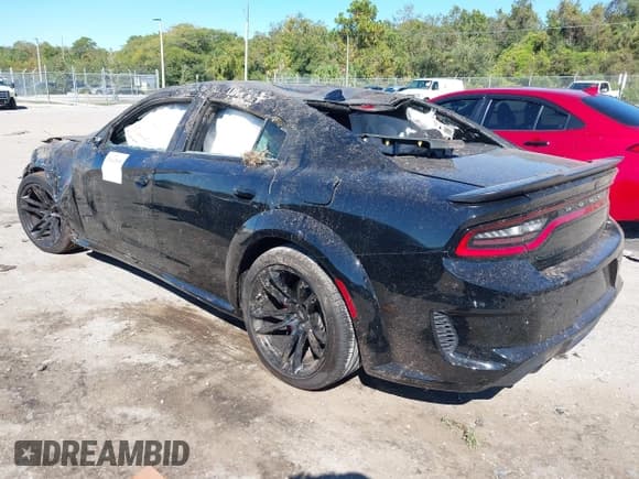 ✅ 2022 Dodge Charger Scat Pack Widebody • VIN: 2C3CDXGJ4NH121940 • Lot: 37847895. Listed on IAAI with 7,493 mi. Free auction sales archive from the USA and detailed vehicle history report at DreamBid. Image 3.