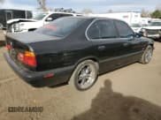 ✅ 1995 BMW 5 Series • VIN: WBAHE6325SGF32682 • Lot: 81988724. Listed on Copart with 164,848 mi. Free auction sales archive from the USA and detailed vehicle history report at DreamBid. Image 3.