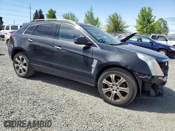 ✅ 2012 Cadillac SRX Performance Collection • VIN: 3GYFNEE39CS626584 • Lot: 55050825. Listed on Copart with 165,114 mi. Free auction sales archive from the USA and detailed vehicle history report at DreamBid. Image 4.