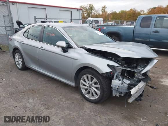 2022 Toyota Camry LE with VIN 4T1R11BK9NU067765, listed as a IAAI auction lot 43431610 with 60,319 mi miles and . Bid and sale history available at DreamBid. Image 1.