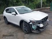 ✅ 2017 Mazda CX-5 Grand Touring • VIN: JM3KFADL9H0190840 • Lot: 43186374. Listed on IAAI with 141,104 mi. Free auction sales archive from the USA and detailed vehicle history report at DreamBid. Image 1.