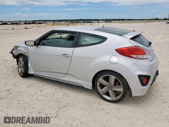 2013 Hyundai Veloster Turbo с VIN KMHTC6AE0DU153926, выставлен на аукционе Copart как лот 66184095 с пробегом 78 193 миль миль и Списание • Salvage title. История ставок и продаж доступна на DreamBid. Изображение 2.