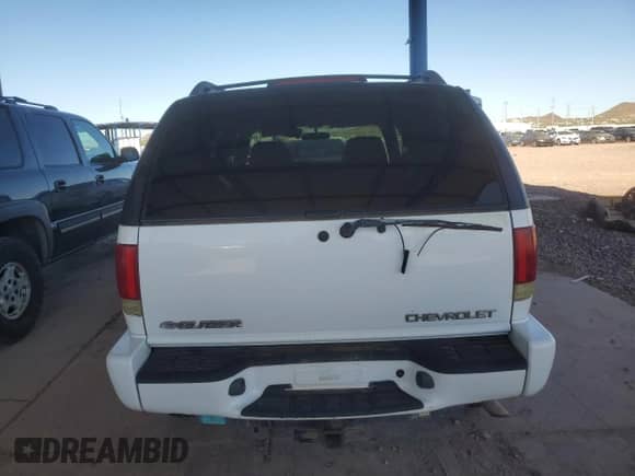 2003 Chevrolet Blazer LS z VIN 1GNDT13X63K170628, wystawiony jako Copart lot #77502884 z przebiegiem Nie podano mil oraz Czysty tytuł • Clean title. Historia ofert i sprzedaży dostępna na DreamBid. Obrazek 6.