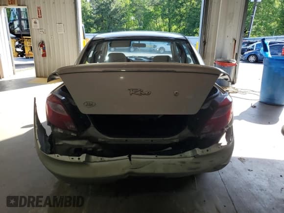 ✅ 2002 Kia Rio • VIN: KNADC123326133077 • Lot: 52427975. Listed on Copart with 105,357 mi. Free auction sales archive from the USA and detailed vehicle history report at DreamBid. Image 6.